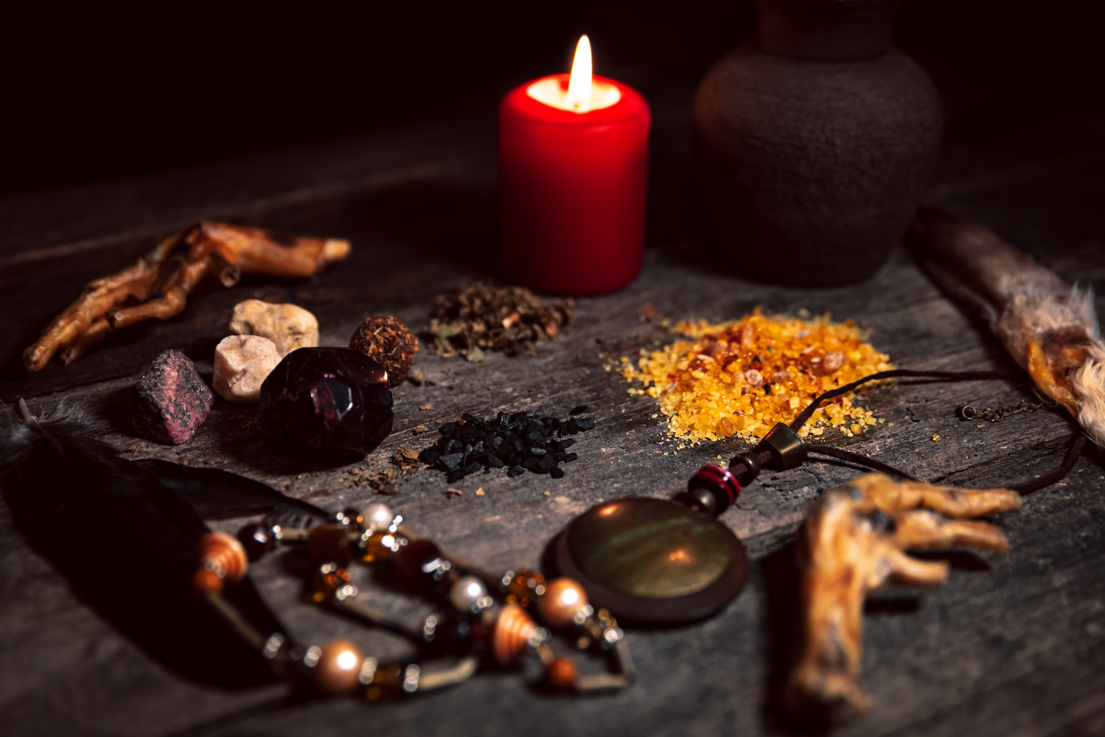 Voodoo or vodun ingredients for an dark ritual, witchcraft and african religion, talisman, incense, crow´s feet and gems